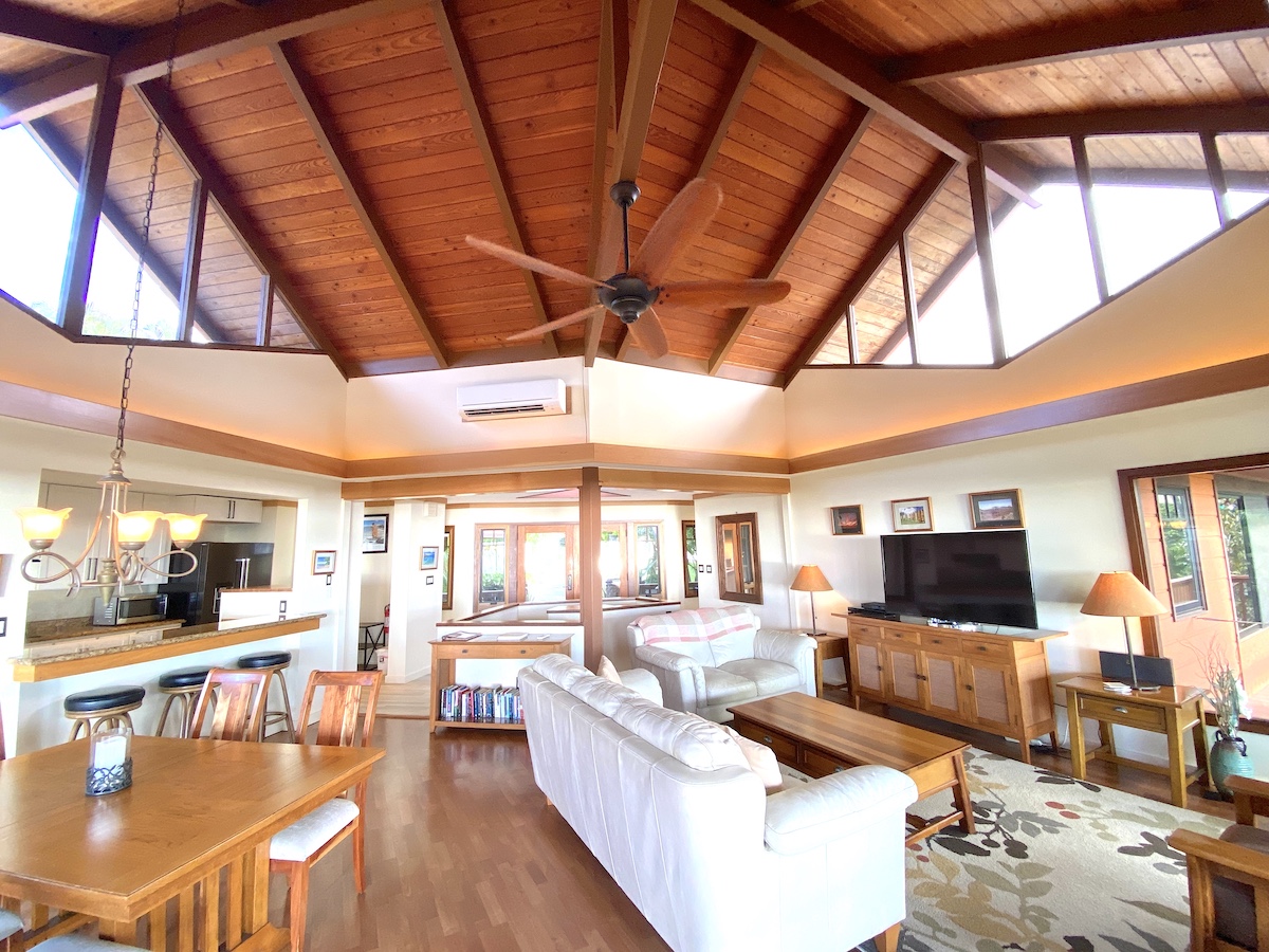 Panoramic view of the living area, kitchen and entry.